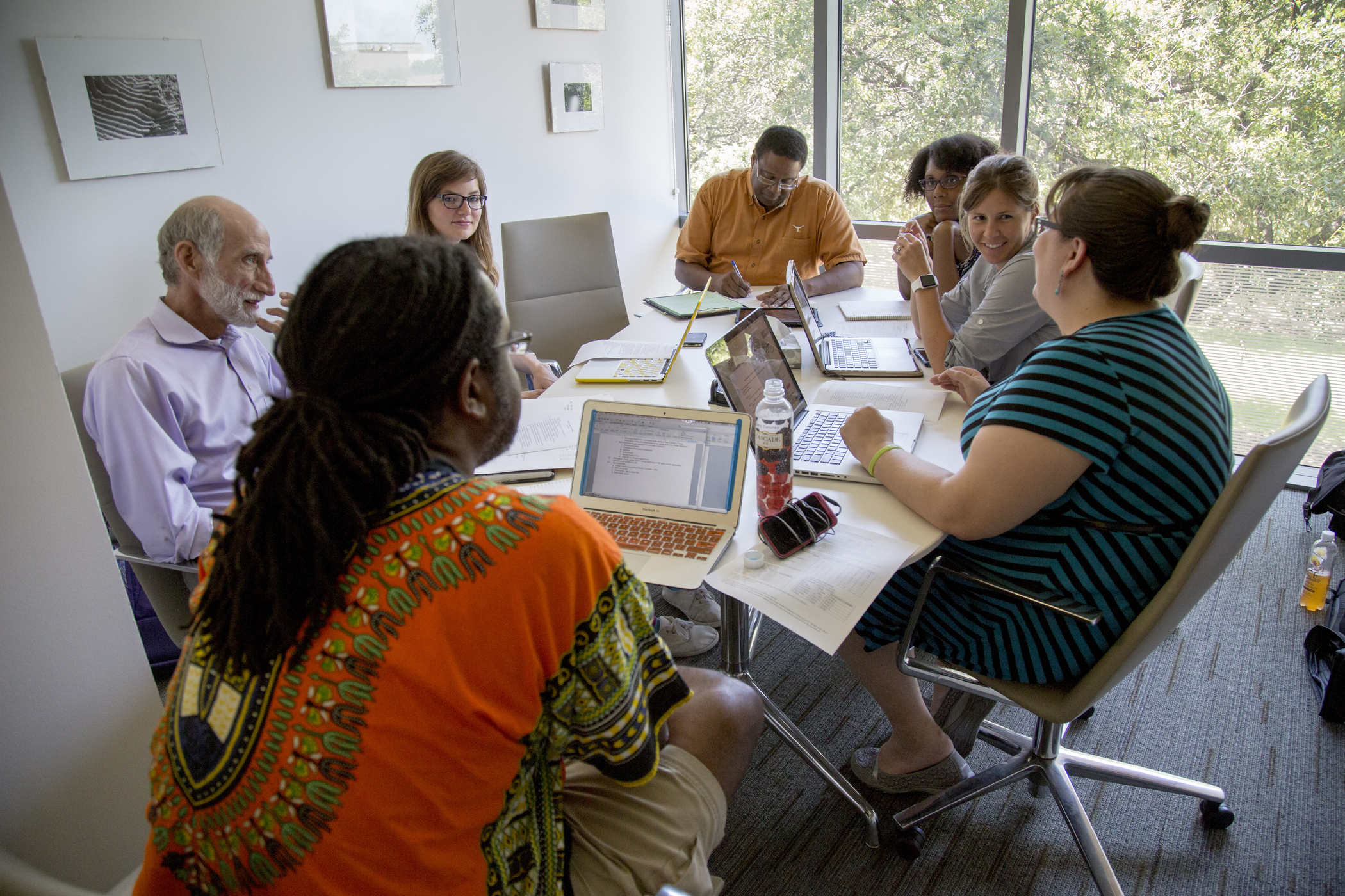 UT Austin faculty and students together in a campus learning setting